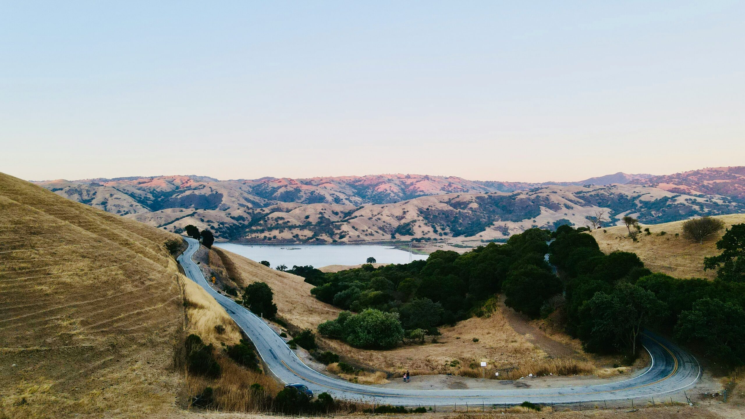 Winding road overlooking mountain reservoir in San Jose